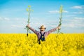 Farmer inspects rapeseed Royalty Free Stock Photo