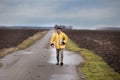 Farmer with laptop in field on winter