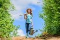 Farmer little girl. garden tools, shovel and watering can. kid worker sunny outdoor. family bonding. spring country side Royalty Free Stock Photo