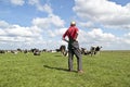 Farmer looking at his cows