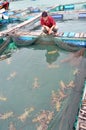 A farmer is looking at his lobster cage farming in the bay of Vung Ro Royalty Free Stock Photo