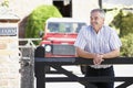 Farmer Looking Over Farm Gate Royalty Free Stock Photo