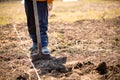 farmer man boot on spade prepare for digging. Worker loosen black dirt soil with shovel in garden at farm. griculture