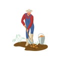 Farmer man with hat and boots is digging potato in garden