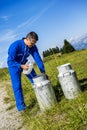 Farmer with milk containers Royalty Free Stock Photo