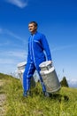 Farmer with milk containers Royalty Free Stock Photo