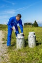 Farmer with milk containers Royalty Free Stock Photo