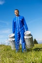 Farmer with milk containers Royalty Free Stock Photo