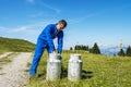 Farmer with milk containers Royalty Free Stock Photo