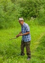 The farmer mows the grass Royalty Free Stock Photo