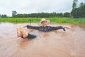 Farmer playing and joyful in heavy flood in rice field