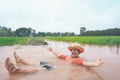 Farmer playing and joyful in heavy flood in rice field