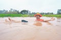 Farmer playing and joyful in heavy flood in rice field