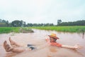 Farmer playing and joyful in heavy flood in rice field