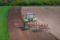 Farmer ploughing field