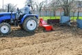 Farmer plows the field. Small tractor with a plow in the field. Cultivation Royalty Free Stock Photo