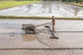 A farmer is plowing with tractor