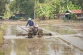 Farmer plowman using tiller tractor Royalty Free Stock Photo