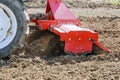 Farmer plows the field. Small tractor with a plow in the field. Cultivation Royalty Free Stock Photo