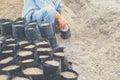 Farmer pouring substrate materials for growing plant. soil fertilizer in planting bag for transplanting seedling Royalty Free Stock Photo