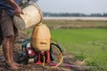 Farmer prepare chemical to sprayer tank before spray to green yo