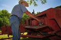 Farmer Preps His Hay Baler Royalty Free Stock Photo