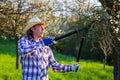 Farmer pruning tree in orchard. Gardening at springtime Royalty Free Stock Photo