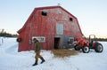 Farmer, Red Barn, and Red Tractor Royalty Free Stock Photo