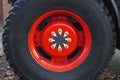 Farmer red tractor wheel large machinery metal rim rubber circle Royalty Free Stock Photo