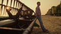 Farmer relax golden field at combine harvester alone. Agribusiness concept