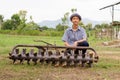 Farmer repair tractor rotary at farm