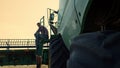 Farmer resting combine field at sunset. Tired worker inspecting stubble farmland Royalty Free Stock Photo