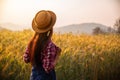 Farmer in ripe wheat field planning harvest activity Royalty Free Stock Photo