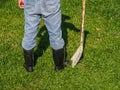 Farmer in rubber boots standing in the field. farm concept. Royalty Free Stock Photo