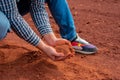 Farmer's hands, calloused and experienced, gently hold the soil, embodying a profound connection to the earth Royalty Free Stock Photo