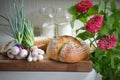 Sourdough Bread, Green Onions, Zinnias Royalty Free Stock Photo