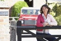 Farmer's Wife Looking Over Farm Gate Royalty Free Stock Photo