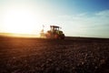 Farmer seeding crops at field