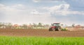 Farmer seeding, sowing crops at field