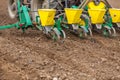 Farmer seeding, sowing crops at field. Sowing is the process of planting seeds in the ground as part of the early spring time agri Royalty Free Stock Photo