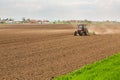 Farmer seeding, sowing crops at field. Royalty Free Stock Photo