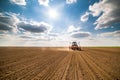 Farmer seeding, sowing crops at field. Royalty Free Stock Photo