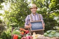 Farmer selling organic veg at market