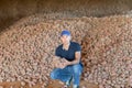 Farmer showing freshly potatoes