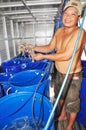 A farmer is showing his shrimps which are stored alive in tanks with oxygen supplement after harvesting and waiting for being tran