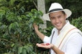 Farmer showing raw coffee beans