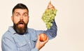 Farmer shows harvest. Winegrower with shocked face