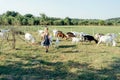 farmer with small goatlings on goats farm