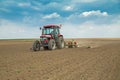Farmer sowing corn maize crops Royalty Free Stock Photo