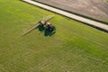 Farmer spraying chemical treatment on an agricultural field